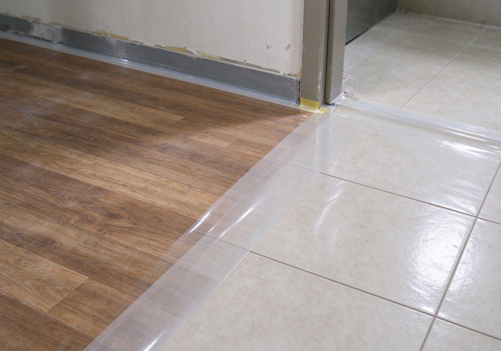 self-adhesive floor protection film applied on wood and tile floors