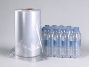 PE shrink film roll next to bottled water multipacks wrapped in LDPE shrink film